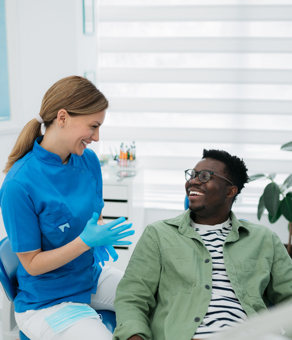 person speaking to the dentist
